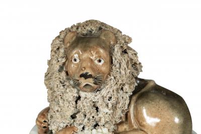 Pair Of European Porcelain Figures of Reclining Lions