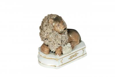Pair Of European Porcelain Figures of Reclining Lions