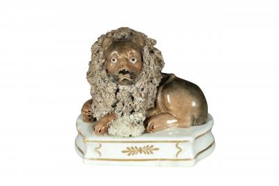 Pair Of European Porcelain Figures of Reclining Lions