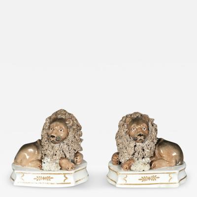 Pair Of European Porcelain Figures of Reclining Lions