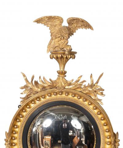 Pair Of Regency Giltwood And Ebonized Convex Girandole Mirrors