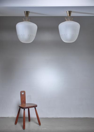 Pair large Art Deco frosted glass and brass pendants