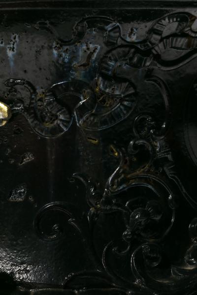 Pair of Antique French Rococo Style Black Iron Urns Adorned with Brass Figures