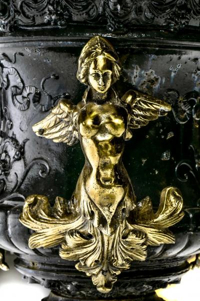 Pair of Antique French Rococo Style Black Iron Urns Adorned with Brass Figures