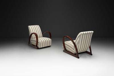 Pair of Art Deco Armchairs with Curved Arms and Striped Upholstery Europe 1930s