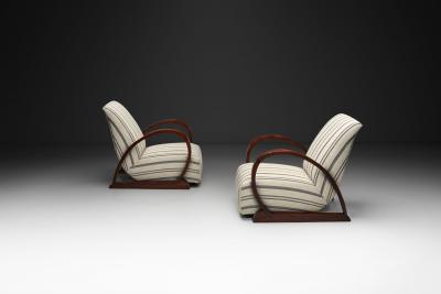 Pair of Art Deco Armchairs with Curved Arms and Striped Upholstery Europe 1930s