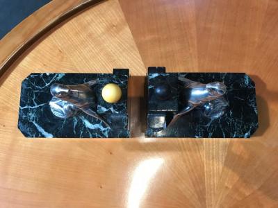 Pair of Art Deco period silvered bronze bookends representing seals