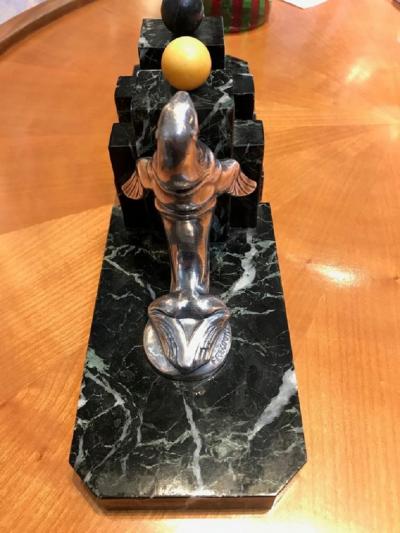 Pair of Art Deco period silvered bronze bookends representing seals