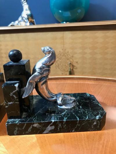 Pair of Art Deco period silvered bronze bookends representing seals