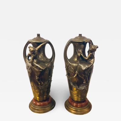 Pair of Art Nouveau Figural Urns Mounted as Lamps