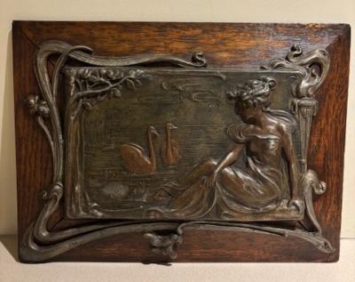Pair of Art Nouveau Metal and Oak Figural Wall Plaque