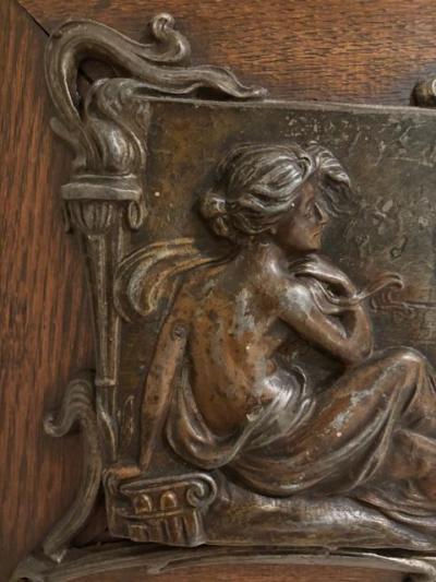 Pair of Art Nouveau Metal and Oak Figural Wall Plaque