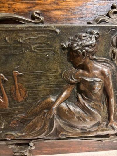 Pair of Art Nouveau Metal and Oak Figural Wall Plaque