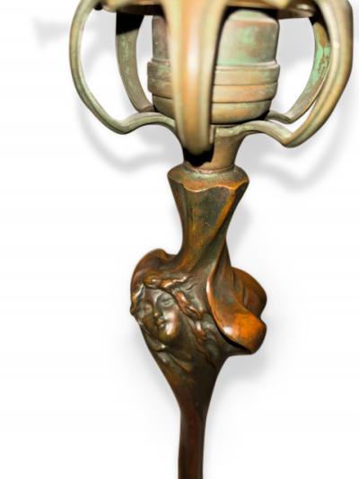 Pair of Art Nouveau candlesticks form lamps with Quezal shades