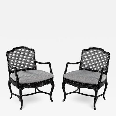 Pair of Black Lacquered Cane Back Lounge Chairs