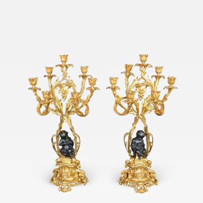 Pair of Bronze Putti Candelabras