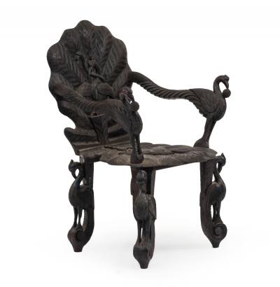 Pair of Burmese Ebonized Carved Arm Chairs