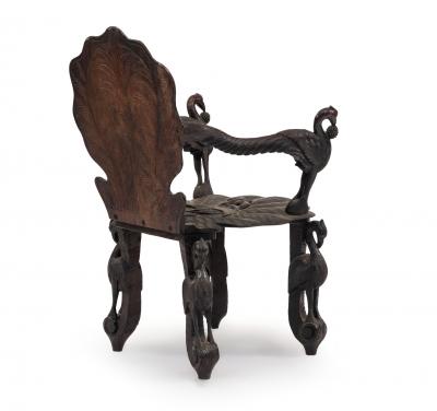 Pair of Burmese Ebonized Carved Arm Chairs