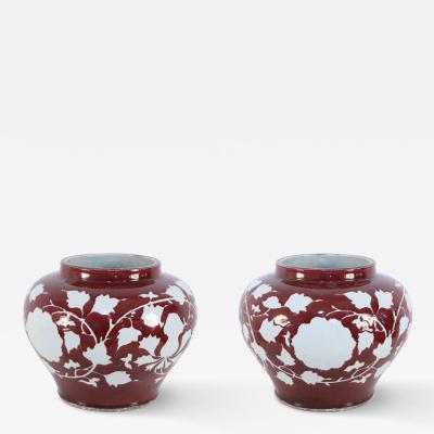 Pair of Chinese Burgundy and White Floral Motif Pots