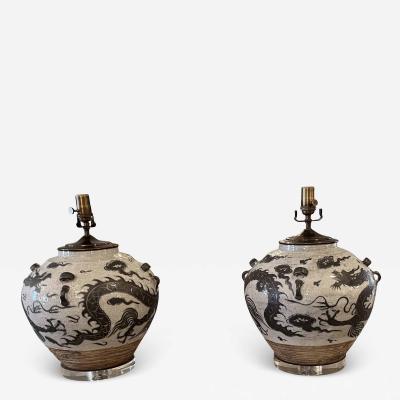 Pair of Chinese export porcelain vases converted to lamps on a lucite base