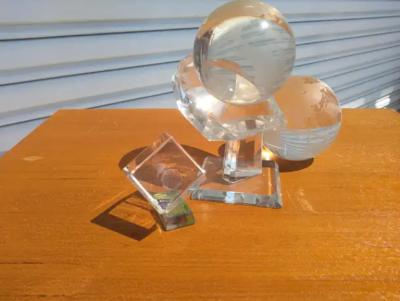 Pair of Crystal Globes on Lucite Stand and Etched Cube