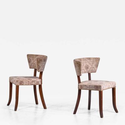 Pair of Danish side chairs with curved backrest