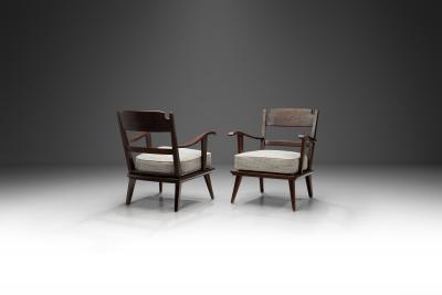 Pair of Dark Stained Pine Armchairs Europe First half of the 20th century