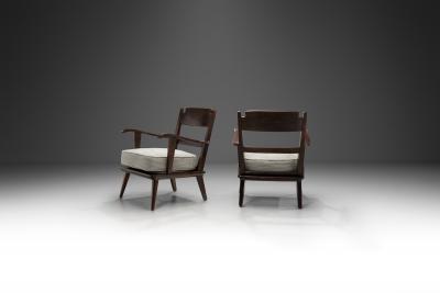 Pair of Dark Stained Pine Armchairs Europe First half of the 20th century