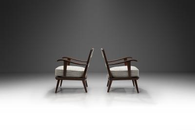 Pair of Dark Stained Pine Armchairs Europe First half of the 20th century