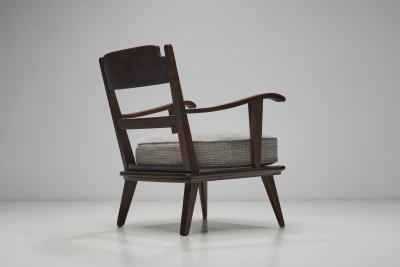 Pair of Dark Stained Pine Armchairs Europe First half of the 20th century