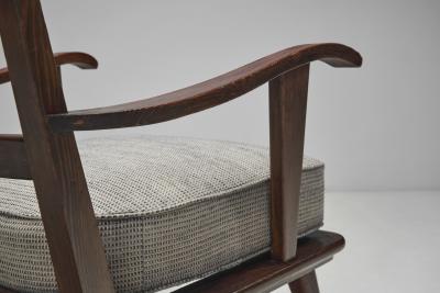 Pair of Dark Stained Pine Armchairs Europe First half of the 20th century