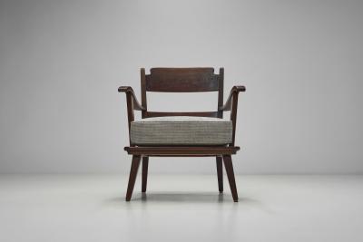 Pair of Dark Stained Pine Armchairs Europe First half of the 20th century