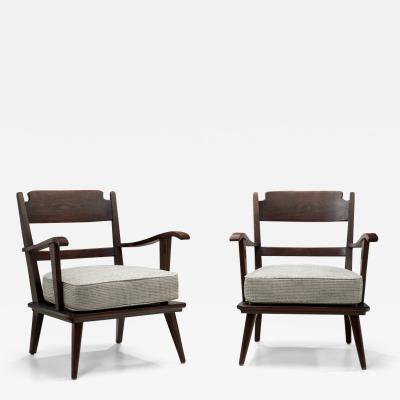 Pair of Dark Stained Pine Armchairs Europe First half of the 20th century