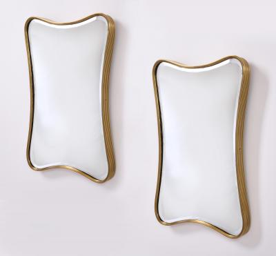 Pair of Diminutive and Charming Shaped Ribbed Brass Mirrors Italy 1950s