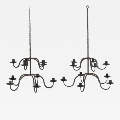 Pair of Early Two Tier Forged Iron Chandeliers