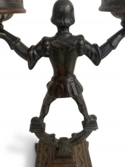 Pair of English 2 arm candlesticks held by a Renaissance style figure