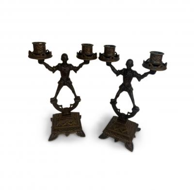 Pair of English 2 arm candlesticks held by a Renaissance style figure