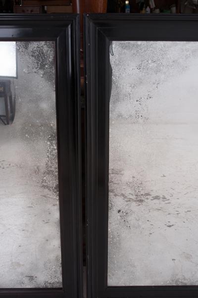 Pair of English 20th Century Ebonized Mirrors