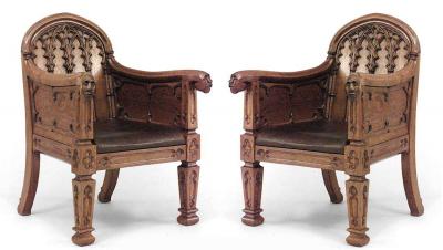 Pair of English Gothic Revival 19th Century oak carved club chairs