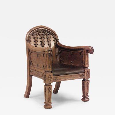 Pair of English Gothic Revival 19th Century oak carved club chairs