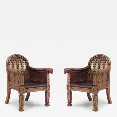 Pair of English Gothic Revival 19th Century oak carved club chairs