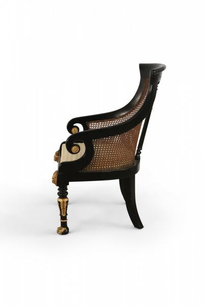 Pair of English Regency Style Carved Black and Giltwood Cane Back Armchairs