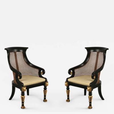 Pair of English Regency Style Carved Black and Giltwood Cane Back Armchairs