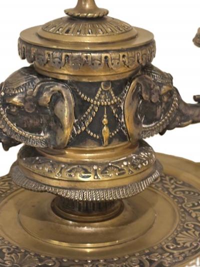 Pair of English Regency bronze candlesticks with 2 elephant heads arms