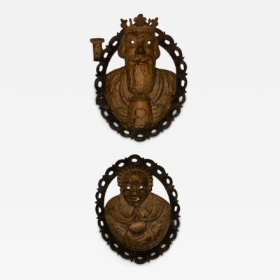 Pair of English Renaissance style metal wall plaques of king and lady
