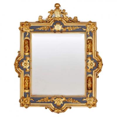 Pair of English gilt bronze and ebonised wood mirrors