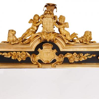 Pair of English gilt bronze and ebonised wood mirrors