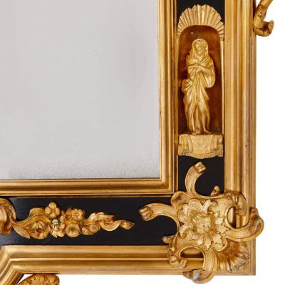 Pair of English gilt bronze and ebonised wood mirrors