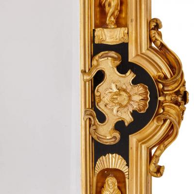 Pair of English gilt bronze and ebonised wood mirrors