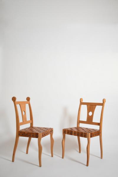 Pair of Etruscan oak and leather chairs 1970s 